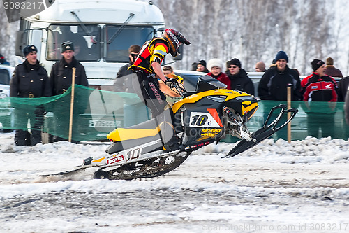 Image of Race of sportsman on snowmobile