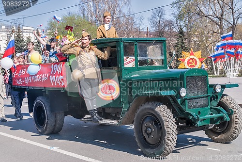 Image of ZIS-5 truck with soldier and girls on parade