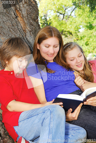 Image of Family reading a book