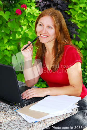 Image of Woman working at home