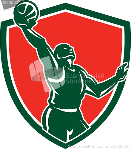 Image of Basketball Player Rebounding Lay-Up Ball Shield