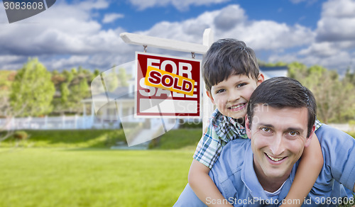 Image of Mixed Race Father, Son Piggyback, Front of House, Sold Sign