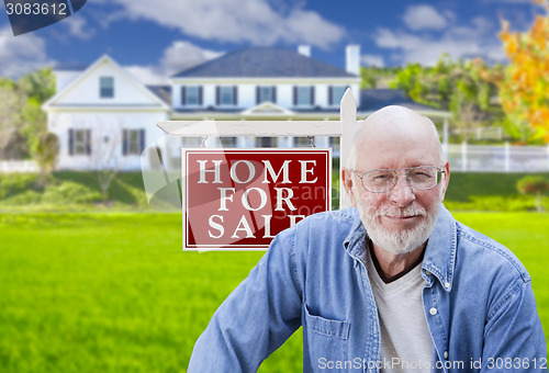 Image of Senior Adult Man in Front of Real Estate Sign, House