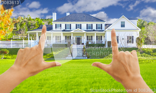 Image of Female Hands Framing Beautiful House