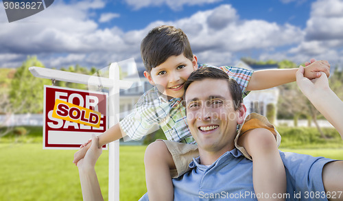 Image of Mixed Race Father, Son Piggyback, Front of House, Sold Sign