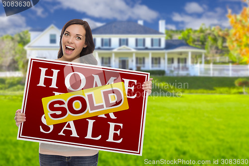 Image of Mixed Race Female with Sold Sign In Front of House