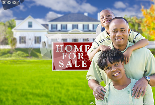 Image of African American Family In Front of Sale Sign and House