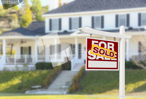 Image of Sold Home For Sale Sign in Front of New House