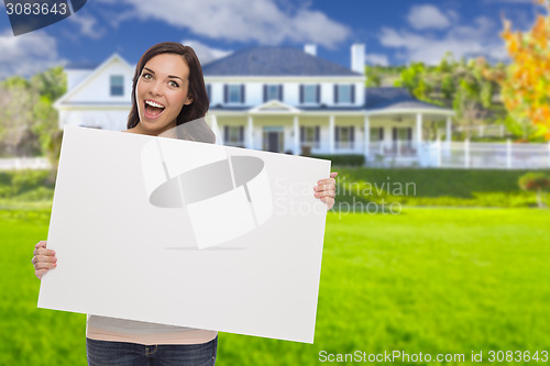 Image of Mixed Race Female with Blank Sign In Front of House