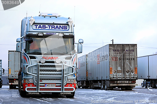 Image of Fleet of Scania Trailer Trucks on Icy Yard