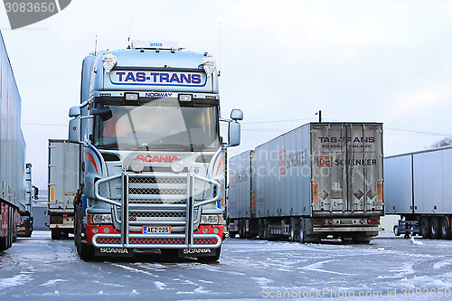 Image of Fleet of Scania Trailer Trucks on Wintry Icy Yard