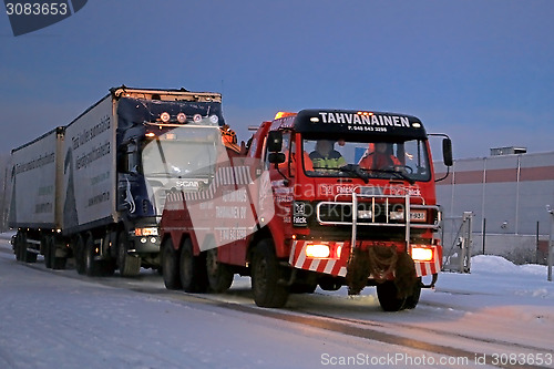 Image of Full Trailer Truck being Towed along Road