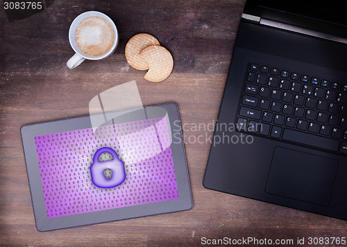 Image of Tablet on a desk, concept of data protection