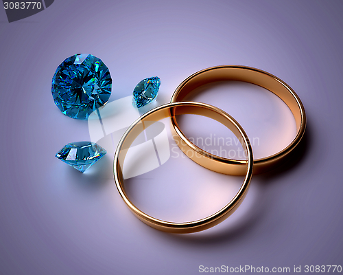 Image of wedding rings and blue gems