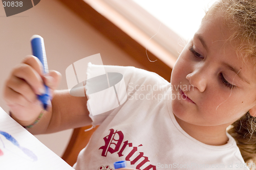 Image of concentrated schoolgirl