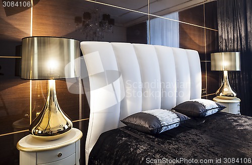 Image of bedroom bed and table lamps Interior