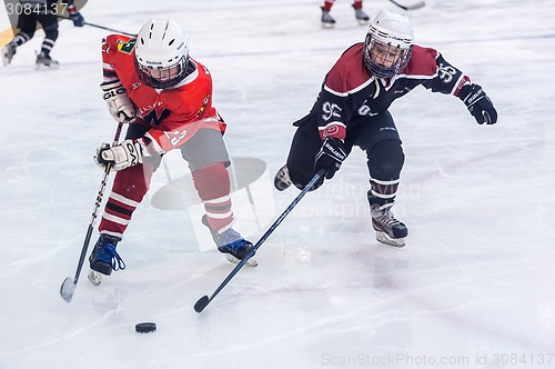 Image of Game of children ice-hockey teams