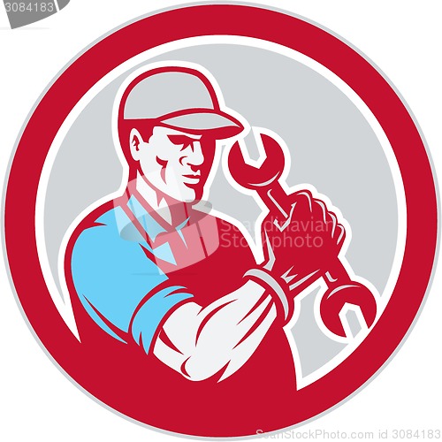 Image of Mechanic Holding Spanner Wrench Circle Retro