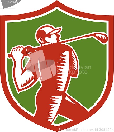 Image of Golfer Swinging Club Shield Woodcut