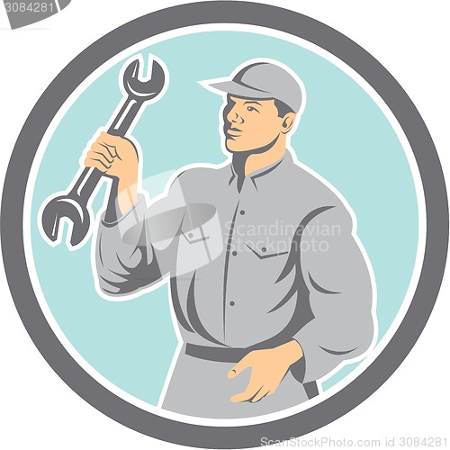 Image of Mechanic Holding Spanner Wrench Circle Retro