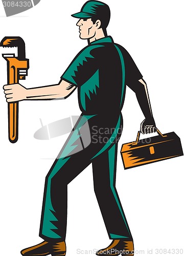 Image of Plumber Walking Carry Toolbox Wrench Woodcut