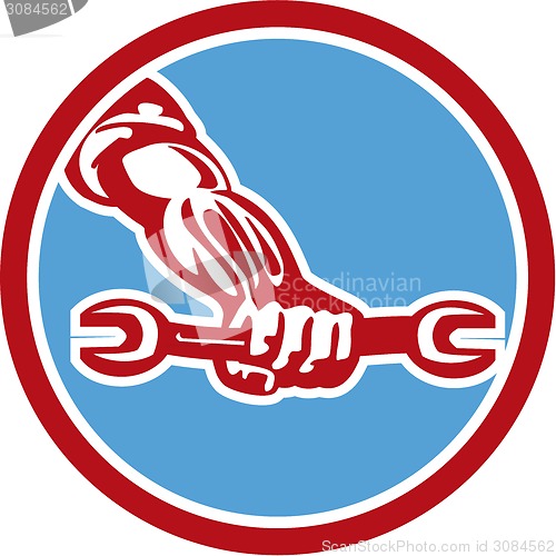 Image of Mechanic Hand Holding Spanner Circle Retro