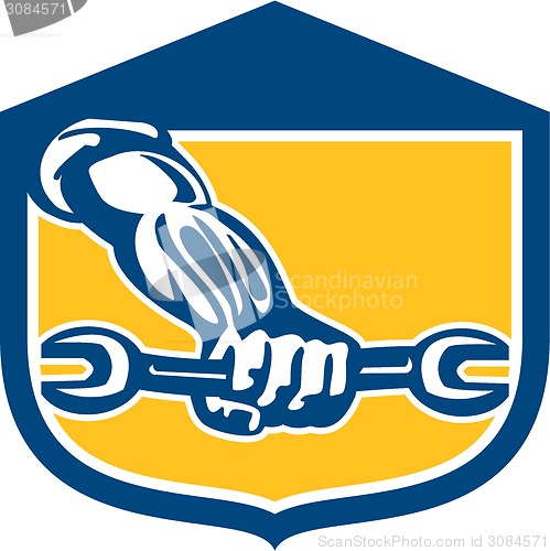 Image of Mechanic Hand Holding Spanner Shield Retro