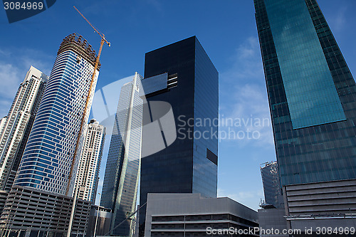Image of high luxury modern building skyscraper, crane