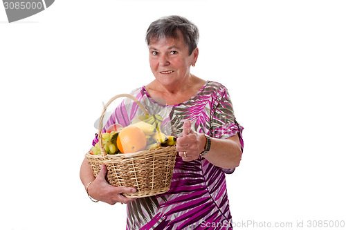 Image of Senior woman with basket of fruit