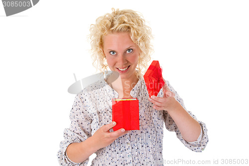 Image of Young woman opening gift box
