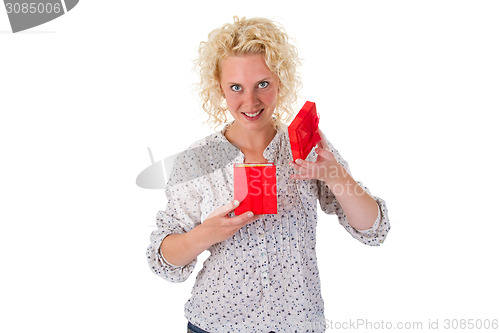 Image of Young woman looking into a gift box