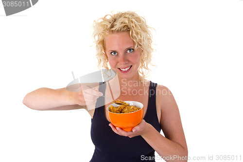 Image of Young woman with cornflakes
