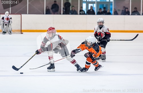 Image of Game between children ice-hockey teams