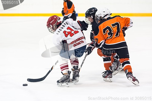 Image of Game between children ice-hockey teams