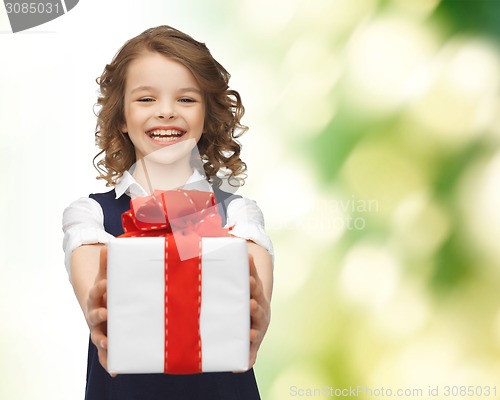 Image of happy smiling girl with gift box