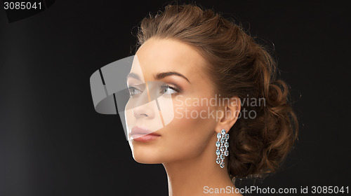 Image of woman with diamond earrings