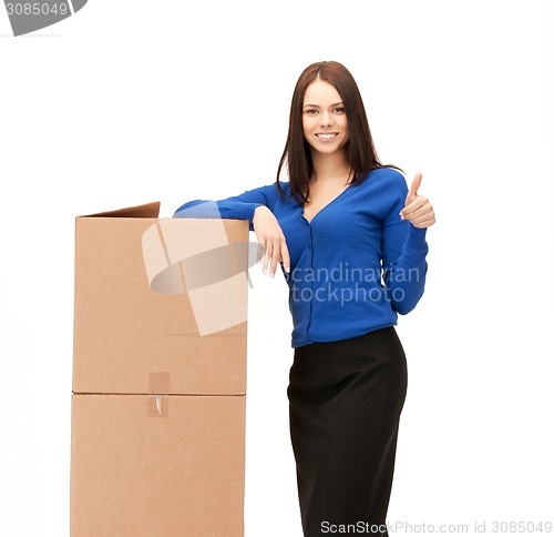 Image of businesswoman with big boxes