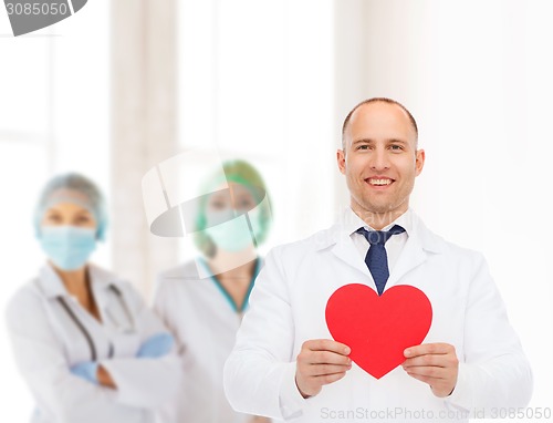 Image of smiling male doctor with red heart