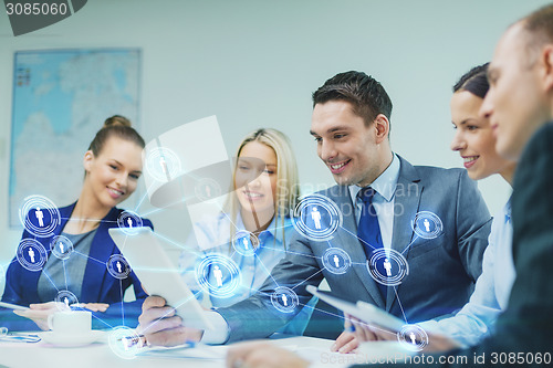 Image of business team with tablet pc having discussion