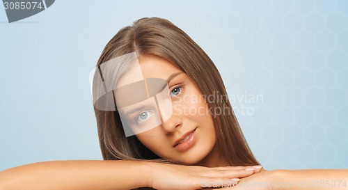 Image of beautiful young woman with bare shoulders