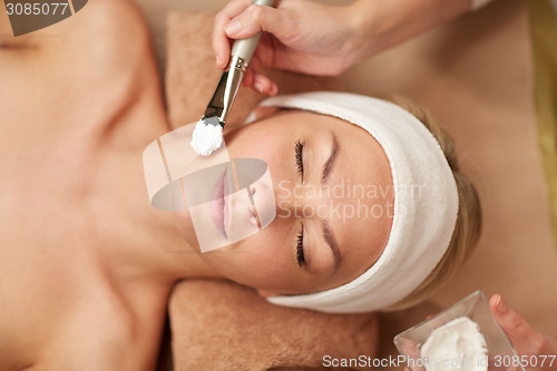 Image of close up of young woman and cosmetologist in spa