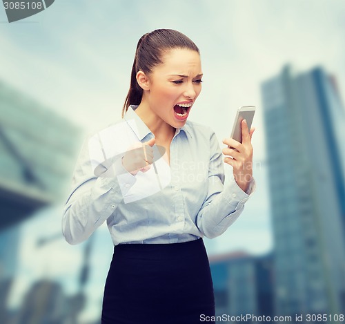 Image of screaming businesswoman with smartphone