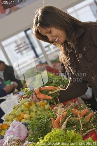 Image of Woman in a vegetable market.