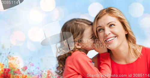 Image of happy daughter whispering gossip to her mother