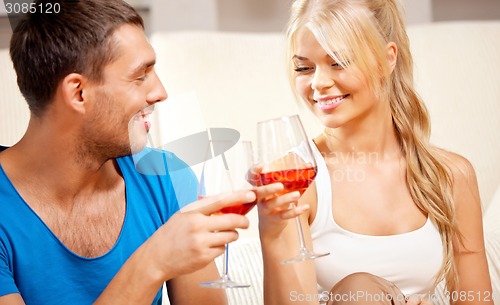 Image of romantic couple drinking wine