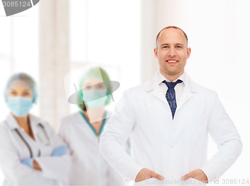 Image of smiling male doctor in white coat