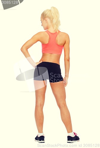 Image of athletic woman in sportswear from the back