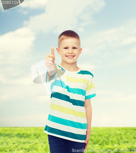 Image of little boy in casual clothes with arms crossed