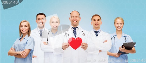 Image of group of smiling doctors with red heart shape