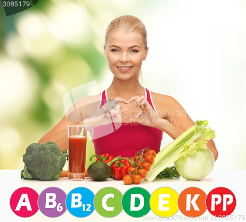 Image of happy woman with organic food and vitamins